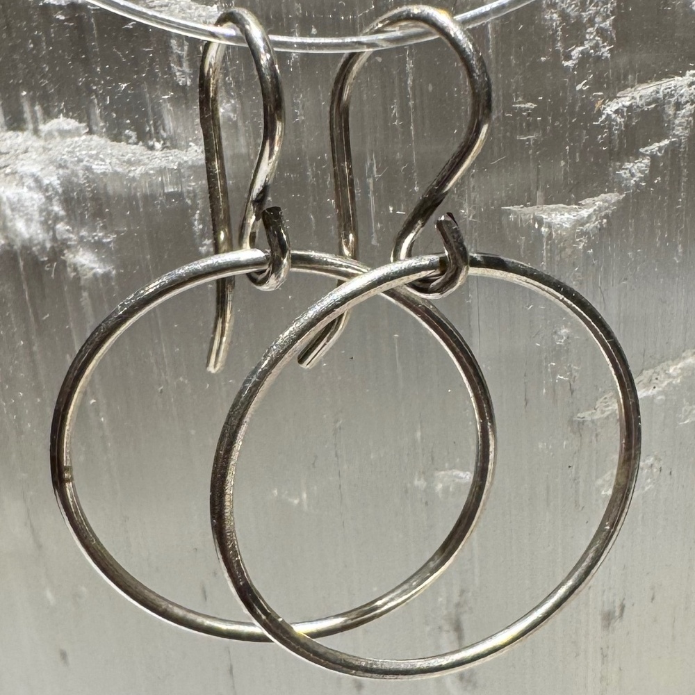 Delicate sterling silver sideways hoops. New!